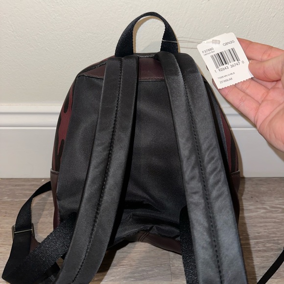 coach backpacks purse Court Backpack In Signature Canvas Refined pebble leather Inside zip cell phone and multifunction pockets Laptop compartment with zip closure Zip closure recycled polyester lining Top handle with 2 drop Outside zip pockets Adjustable shoulder straps Fits a 12 (zip compartment) or 13 (main compartment) laptop 10 3/4 (L) x 14 (H) x 5 1/4 (W) Style No. Coach Charter Signature Leather Backpack